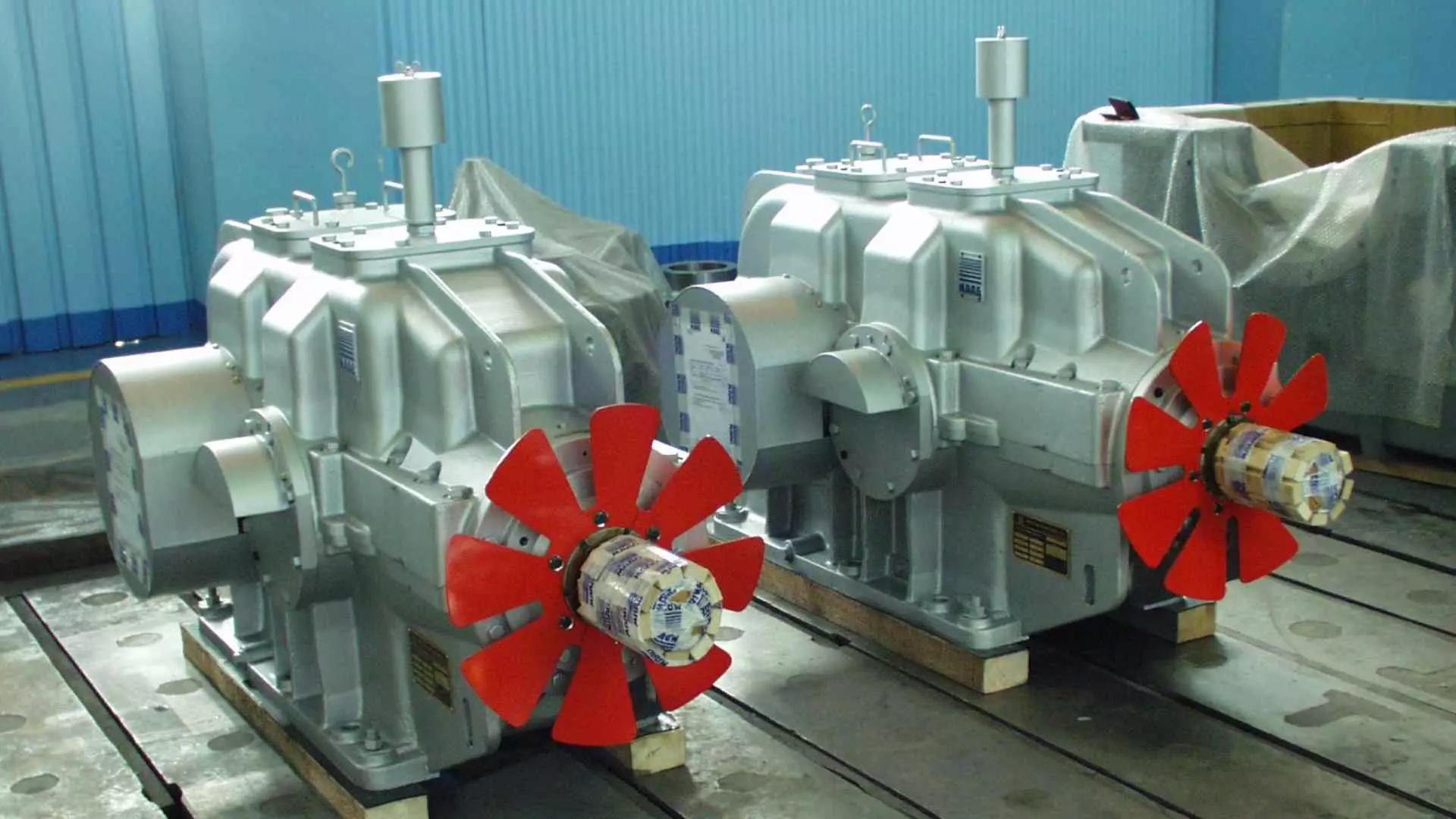 Two MAAG® KA gear units with red fan installed on the input shaft